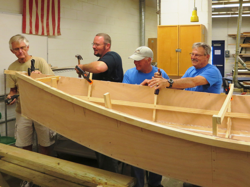 Members of The Lewes Historical Society’s Wooden Boat Volunteer Crew brought a Bevin’s Skiff kit to Milford High School to teach, assemble, and integrate the project into the curriculum. Working on the project are (l-r) Loren Bystol, Milford teacher Chris Stahl, Peter Issel and Bob Kotowski. SOURCE SUBMITTED